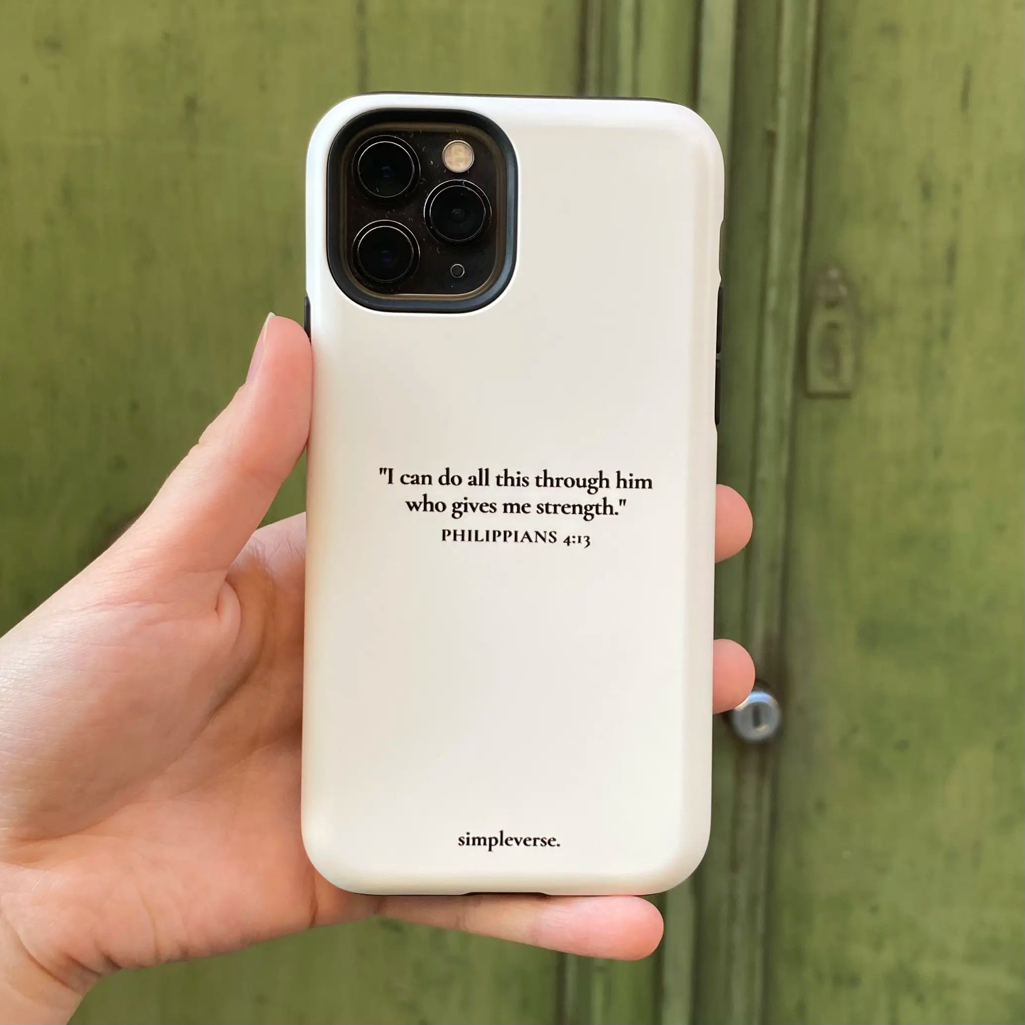 Christian iPhone case with 'I can do all this through him who gives me strength. Philippians 4:13' inscription on a white background.