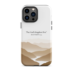 Christian iPhone case with the inspirational Matthew 6:33 verse, featuring a serene mountain scene.