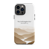 Christian iPhone case with the inspirational Matthew 6:33 verse, featuring a serene mountain scene.