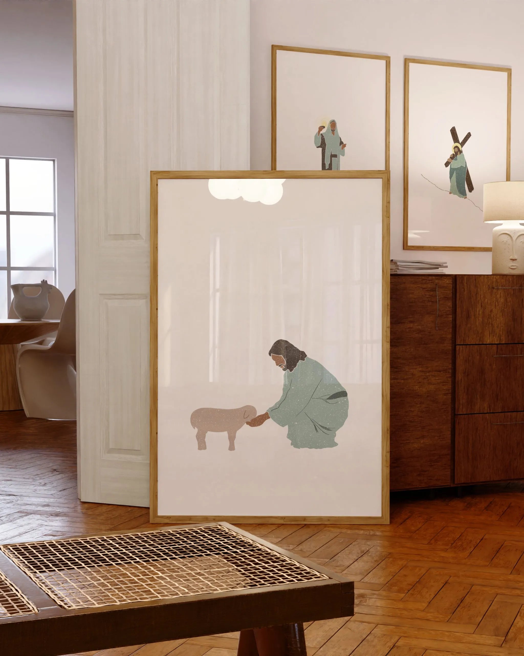 Good Shepherd printable Christian poster leaning on console in cozy room with rattan accents.
