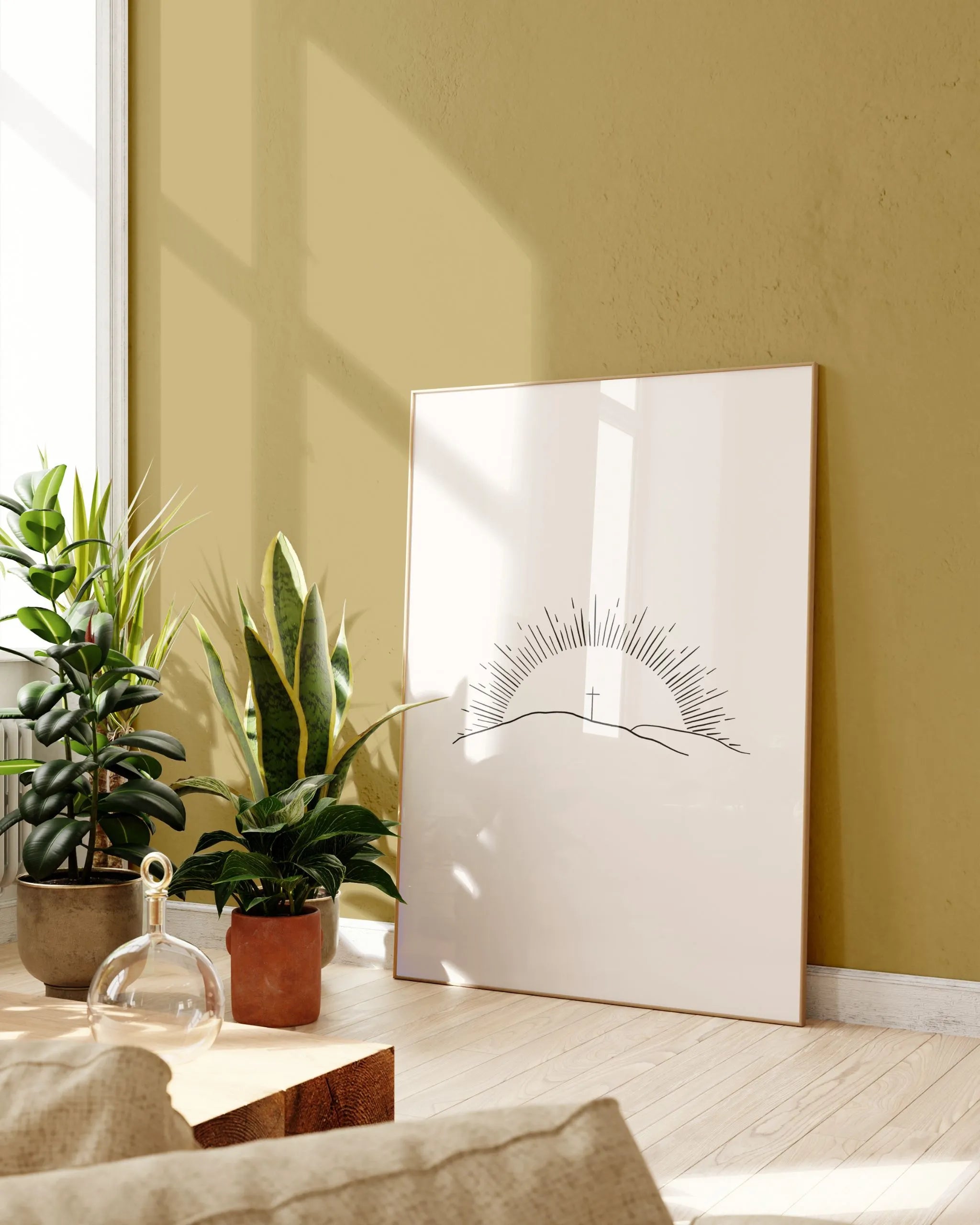 “Morning of Joy” sunrise line art framed near plants, minimalist printable wall art.