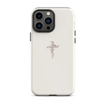 Close-up of a white iPhone case with a detailed nail cross enwreathed by a rose, signifying devotion and grace