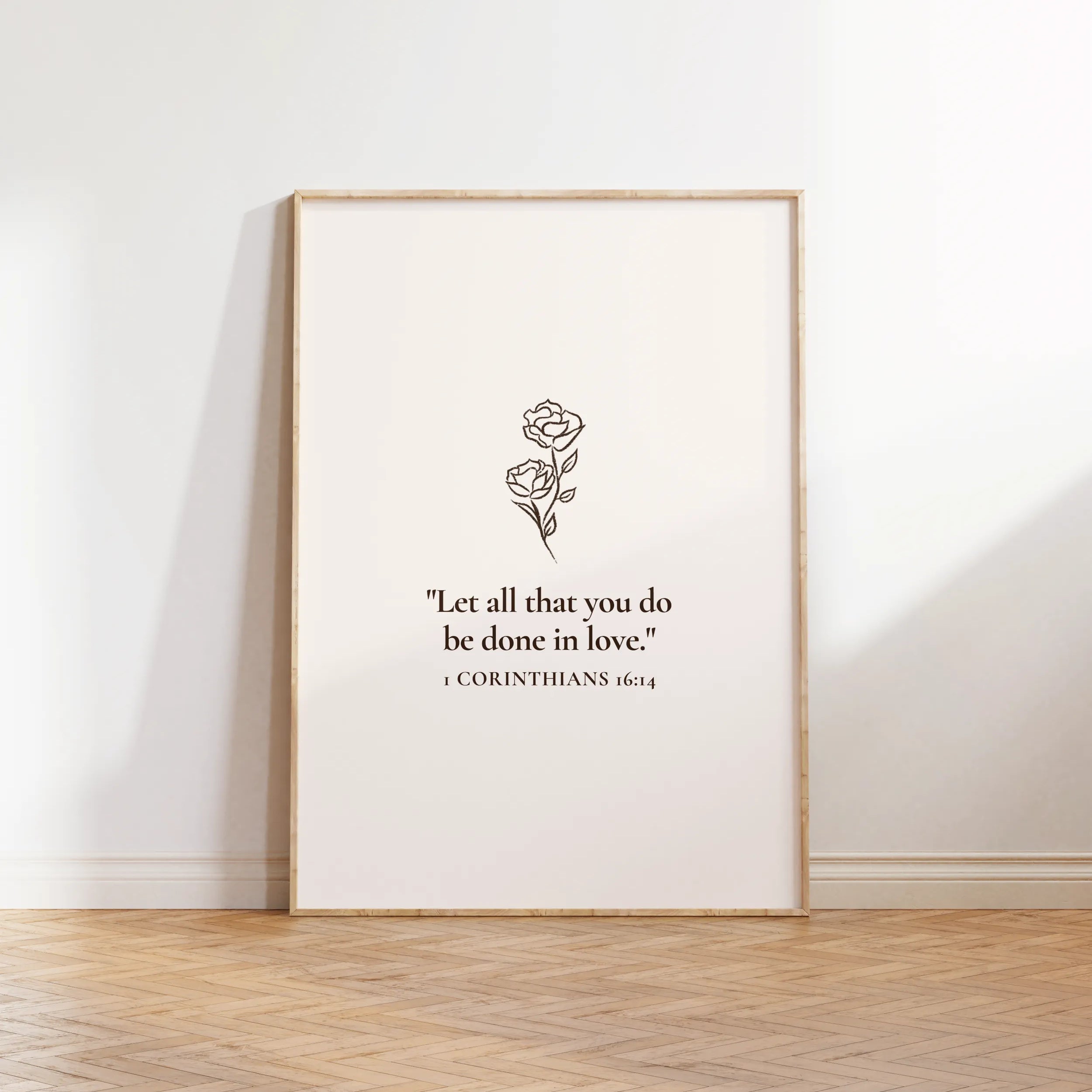 Christian wall art “All Things in Love” framed print leaning on floor.