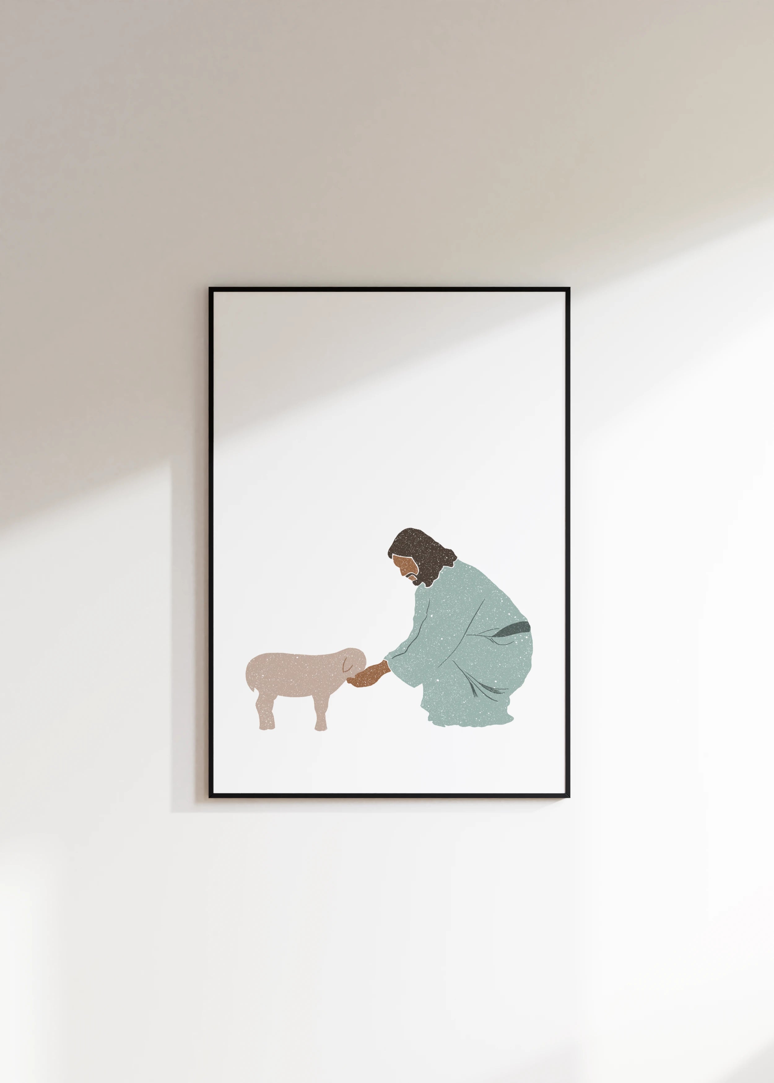Modern Christian print of Jesus with lamb in black frame