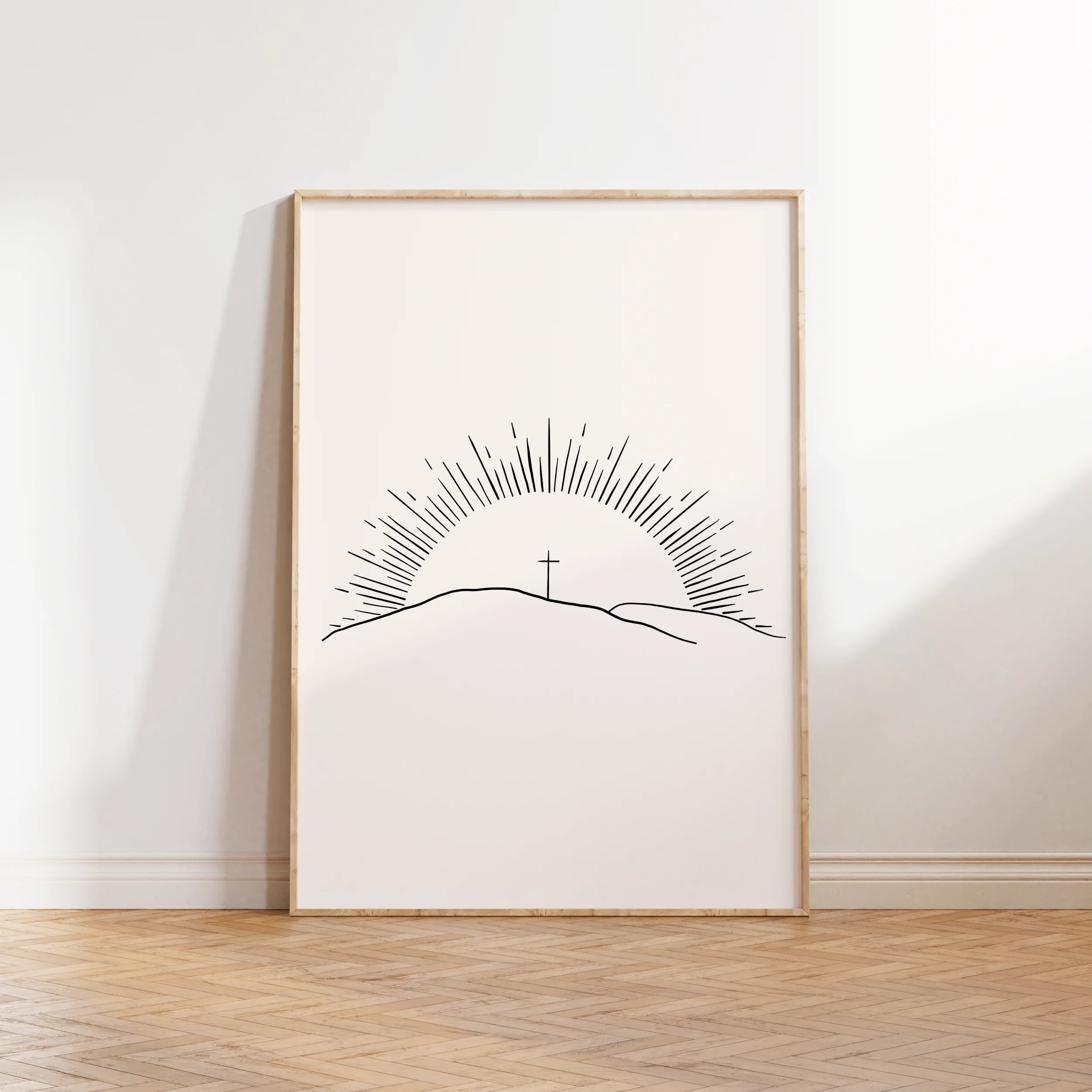 “Morning of Joy” sun-ray Christian wall art framed on floor.