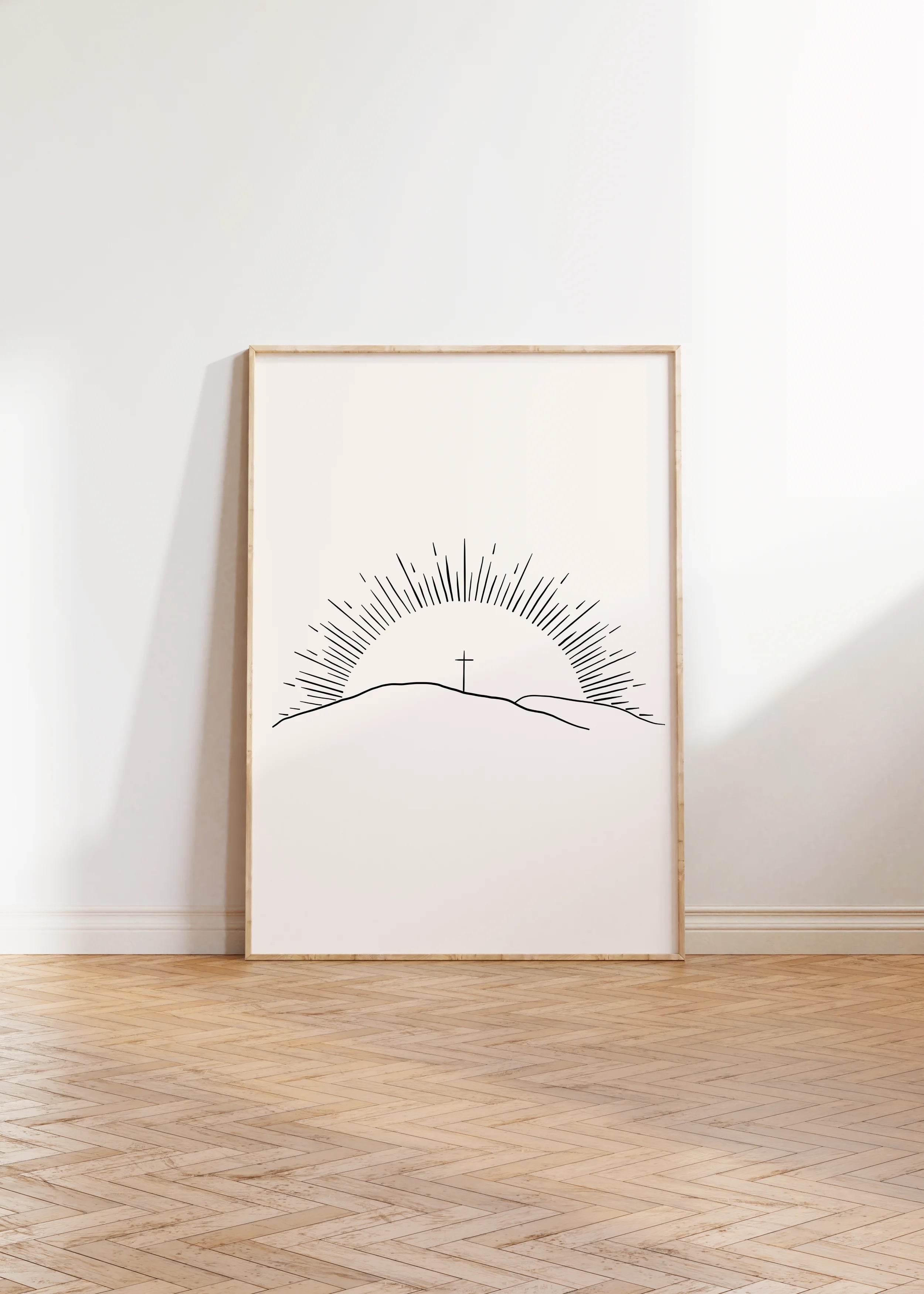 “Morning of Joy” sun-ray Christian wall art framed on floor.